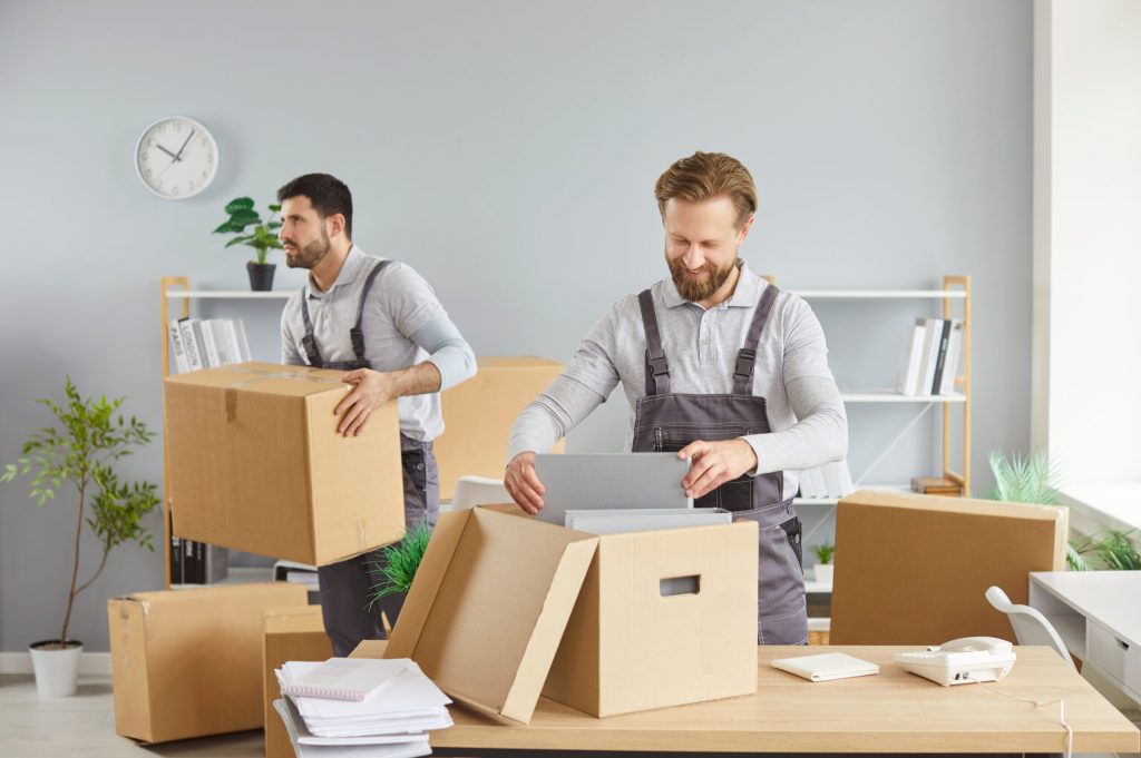 moving delivery pack service, male movers team moving cardboard boxes, loading, unloading